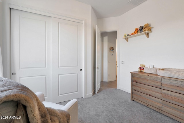 carpeted bedroom featuring a closet