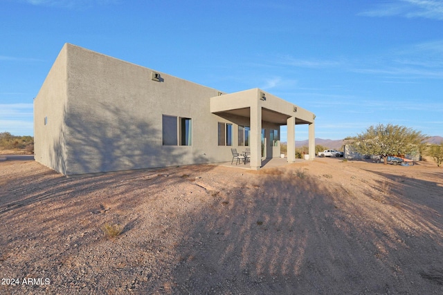 back of house featuring a patio