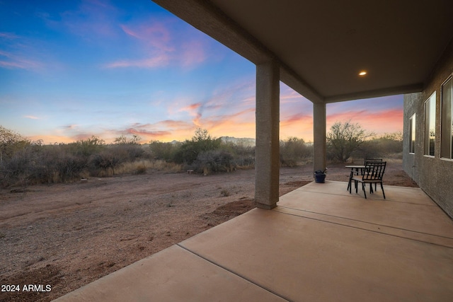 view of patio terrace at dusk