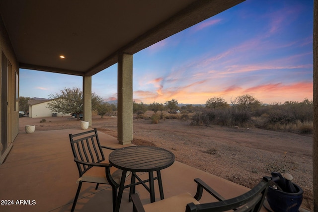 view of patio terrace at dusk