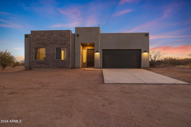 view of front of property with a garage