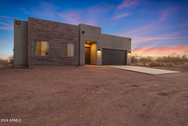 view of front of property with a garage