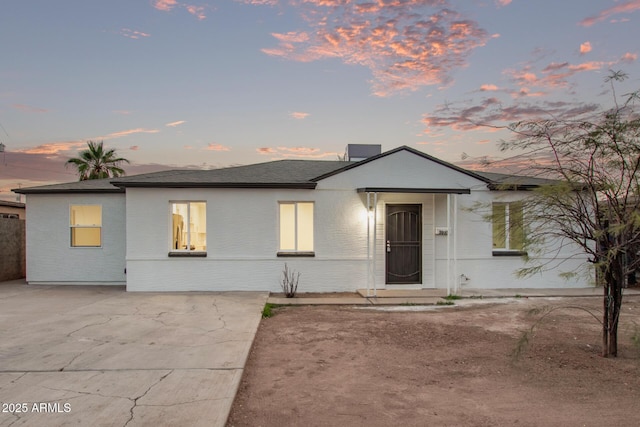 3035 W Pierce St, Phoenix, AZ 85009 - ranch-style home with brick siding and a shingled roof