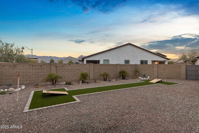 view of yard at dusk