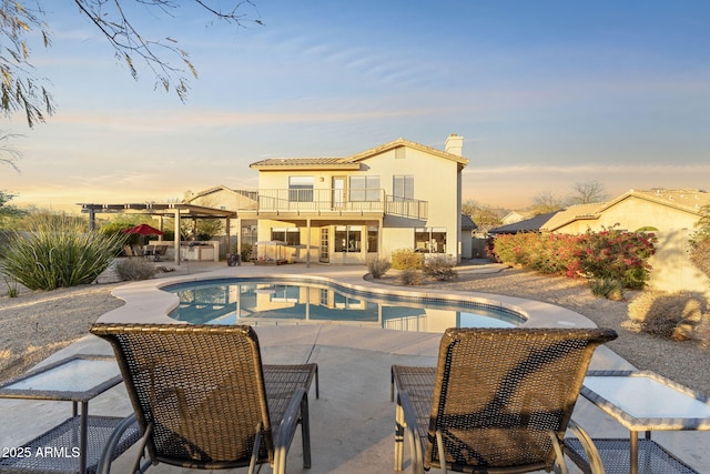 outdoor pool featuring a patio area