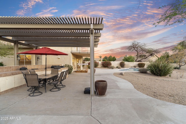 patio terrace at dusk with a pergola, outdoor dining area, and a grill