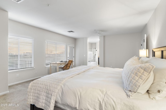 carpeted bedroom with baseboards and visible vents