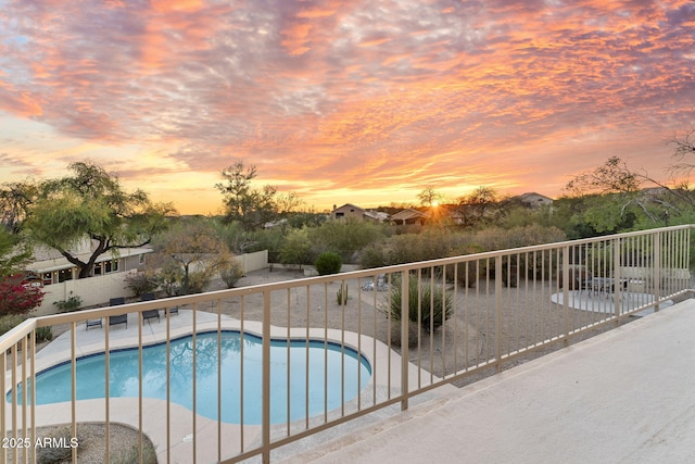 view of swimming pool with a fenced backyard, a patio, and a fenced in pool