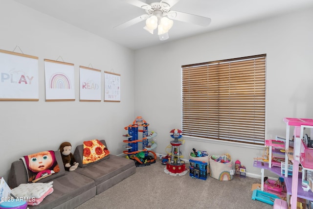 recreation room with ceiling fan and carpet floors