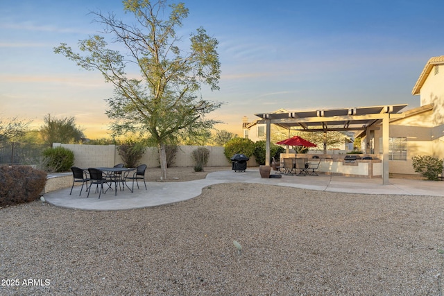 view of yard featuring a fenced backyard, outdoor dining space, a pergola, and a patio