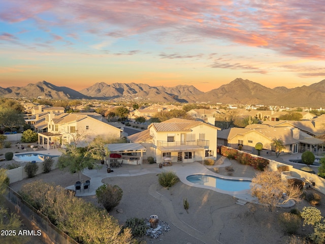 aerial view at dusk with a residential view and a mountain view