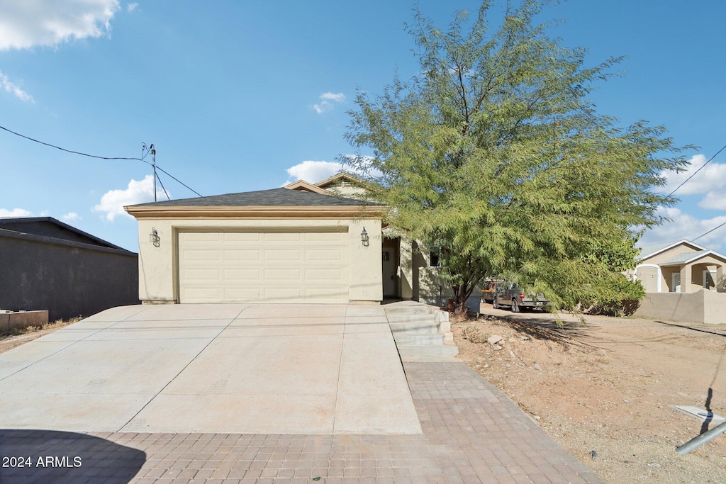 view of front of home with a garage