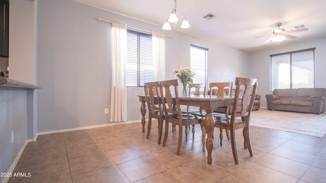 18269 W Vogel Ave, Waddell, AZ 85355 - dining area featuring healthy amount of natural light, light tile patterned floors, a ceiling fan, and baseboards