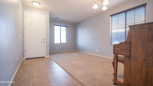 18269 W Vogel Ave, Waddell, AZ 85355 - carpeted spare room featuring baseboards, a chandelier, and tile patterned flooring