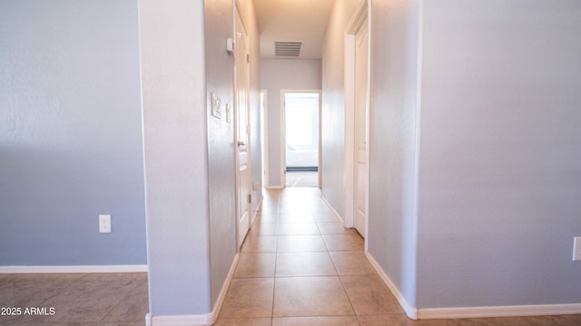 18269 W Vogel Ave, Waddell, AZ 85355 - corridor featuring light tile patterned floors and baseboards