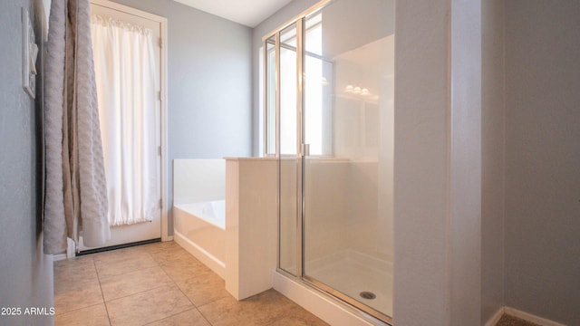 18269 W Vogel Ave, Waddell, AZ 85355 - bathroom with a shower stall, a garden tub, and tile patterned flooring