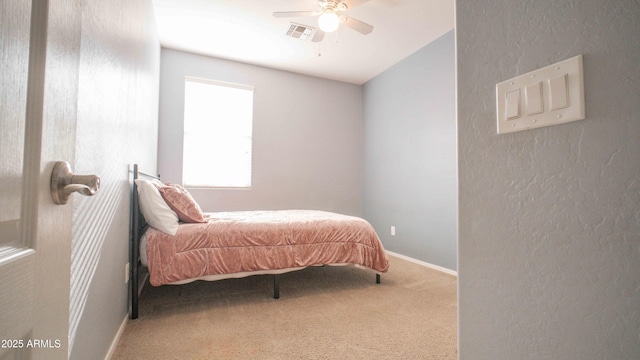18269 W Vogel Ave, Waddell, AZ 85355 - carpeted bedroom with baseboards, a textured wall, and ceiling fan