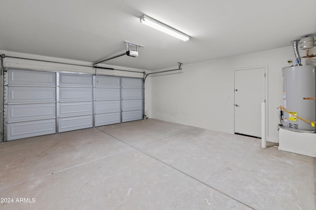 garage featuring a garage door opener and gas water heater