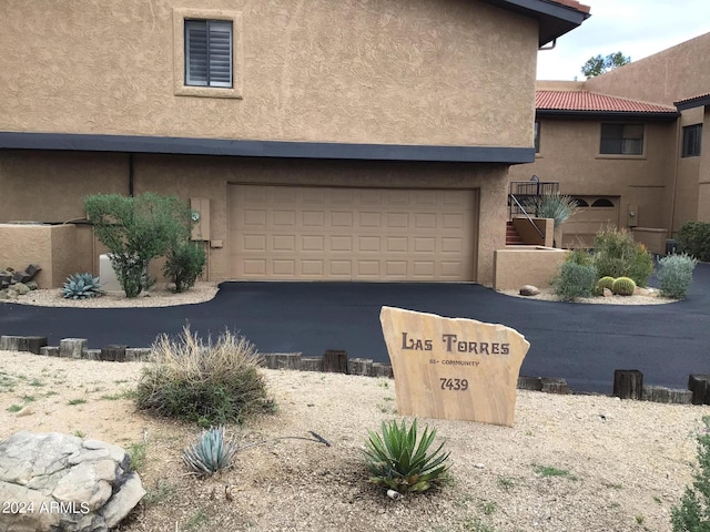 view of front of property featuring a garage