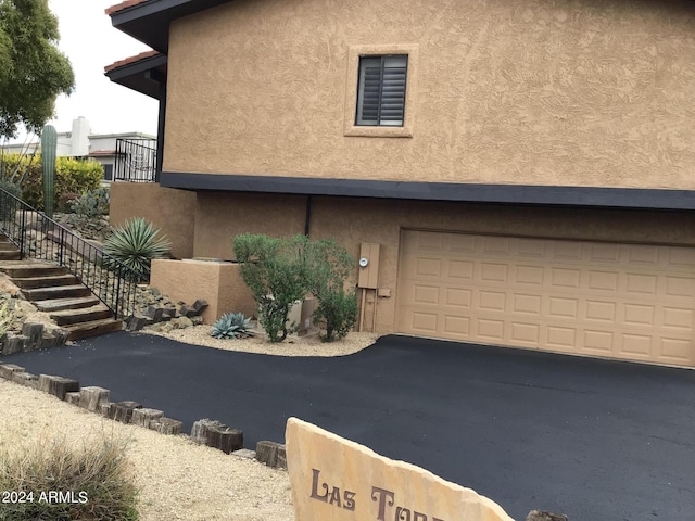 view of side of property featuring a garage