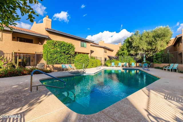 view of swimming pool with a patio