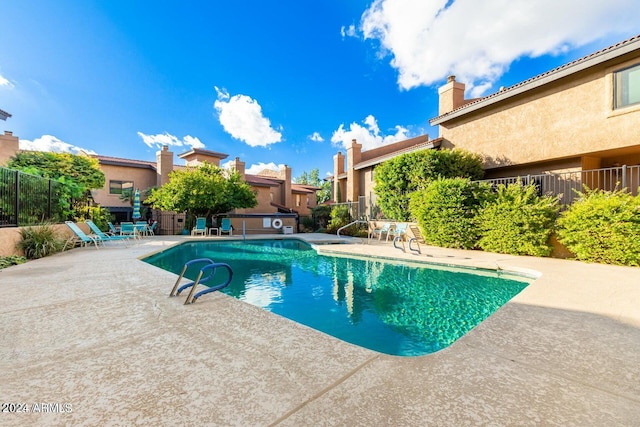 view of pool featuring a patio