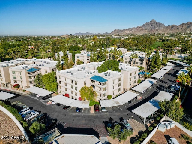 birds eye view of property featuring a mountain view