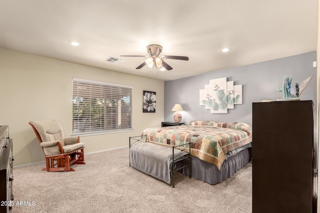 bedroom with ceiling fan and light colored carpet