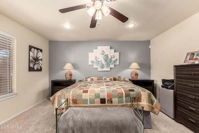 bedroom with ceiling fan and light colored carpet