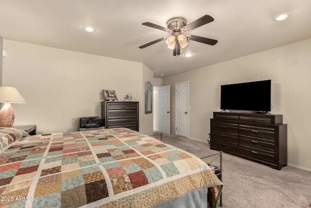 bedroom featuring light colored carpet and ceiling fan