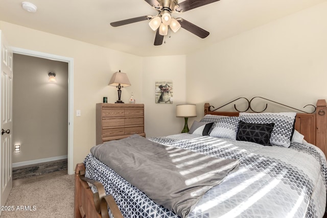 bedroom featuring ceiling fan and light carpet