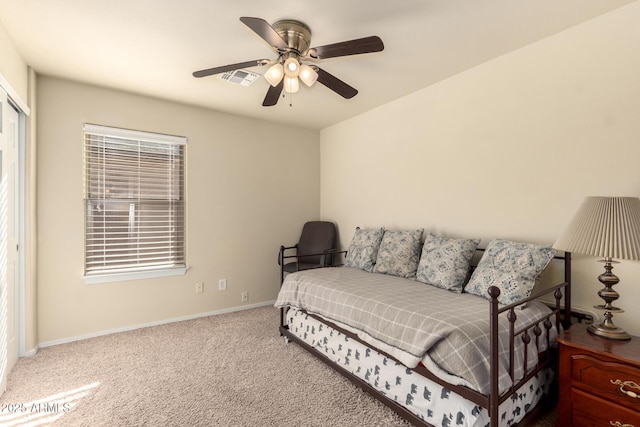 carpeted bedroom with ceiling fan