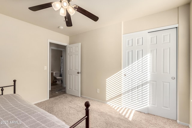 unfurnished bedroom featuring ceiling fan, carpet, and a closet