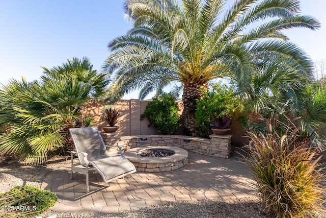 view of patio with an outdoor fire pit