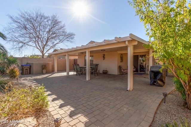 back of property featuring a patio area