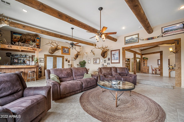 living room with beam ceiling, ceiling fan, and french doors