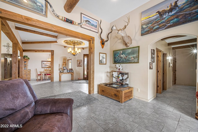 living room with beam ceiling and a chandelier