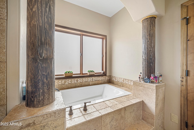 bathroom featuring tiled tub