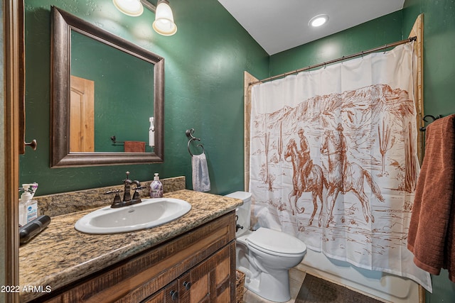 full bathroom with tile patterned flooring, shower / tub combo with curtain, vanity, and toilet