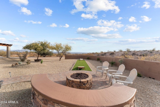 view of patio / terrace with a fire pit