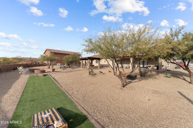 exterior space featuring a fire pit and a patio area