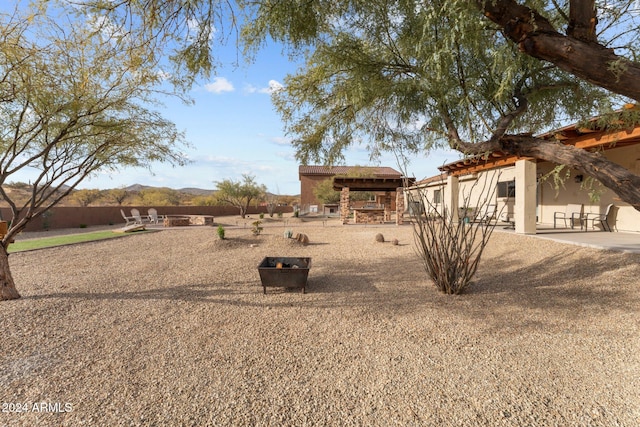 view of yard featuring a patio area and a mountain view