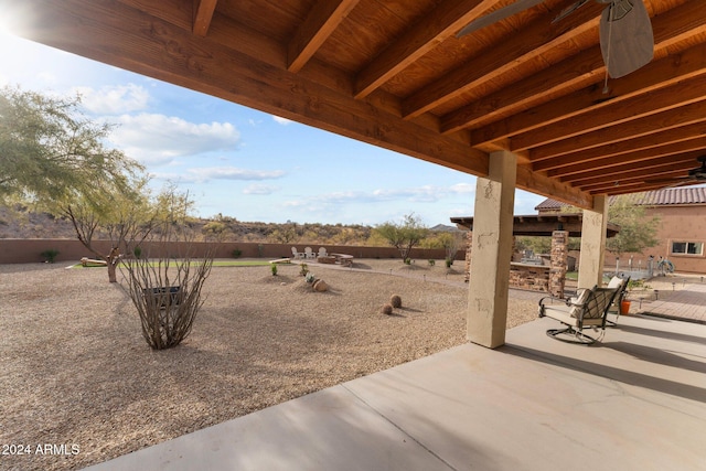 view of patio featuring ceiling fan