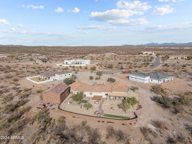 birds eye view of property featuring a mountain view