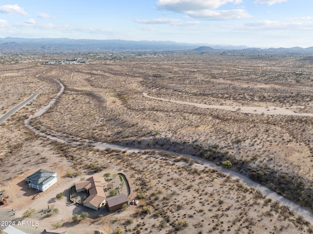 birds eye view of property featuring a mountain view