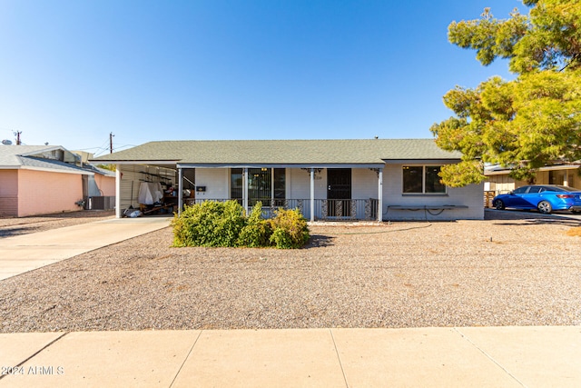 ranch-style home with a carport and a porch