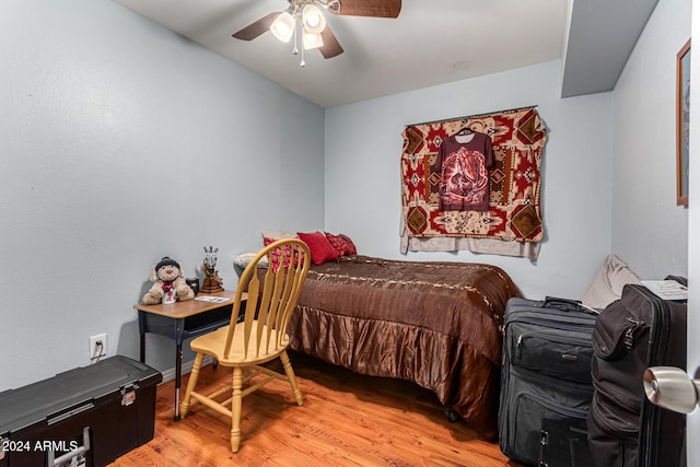 bedroom featuring light wood-type flooring and ceiling fan