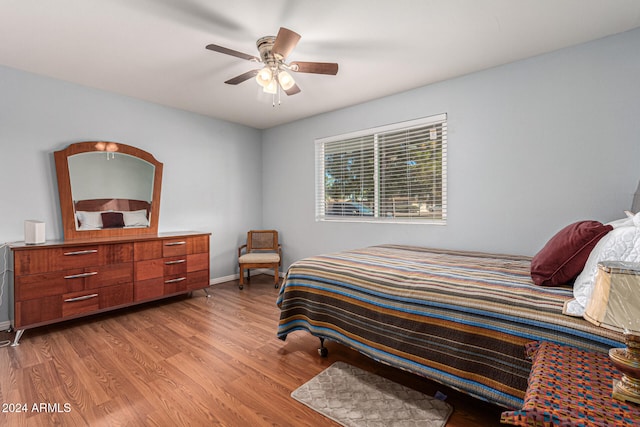 bedroom featuring ceiling fan and light hardwood / wood-style floors