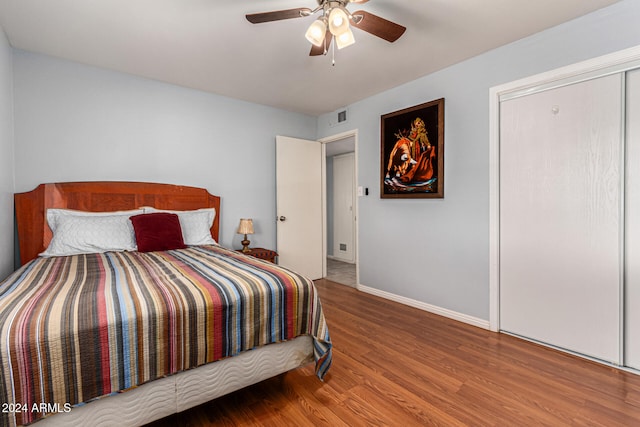 bedroom with ceiling fan and hardwood / wood-style floors