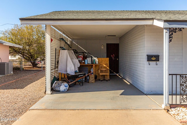 exterior space featuring a carport and central AC unit